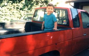 MATTY IN THE BED OF ROBIN'S RED TRUCK