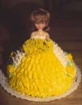 Girl in yellow floor length ballgown with wide skirt