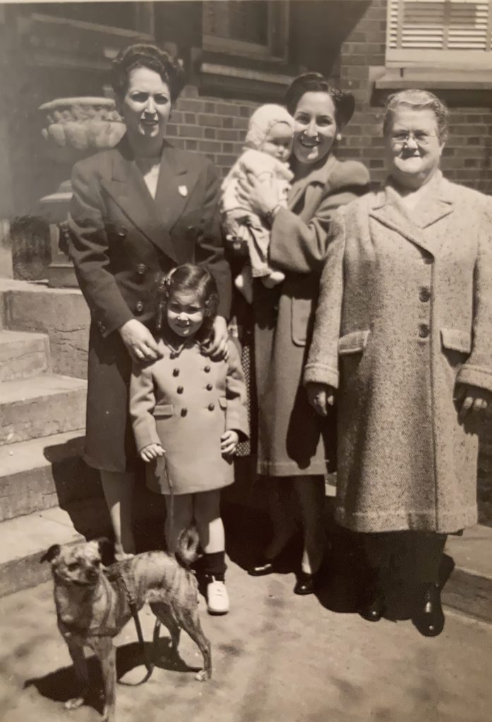 Sepia photo of Hannah (Ben) Mayov and daughter Glenda; Anne Mayov Singer and daughter Joyce; Shifra Mayov (wife of Israel Mayov) and Glenda's dog