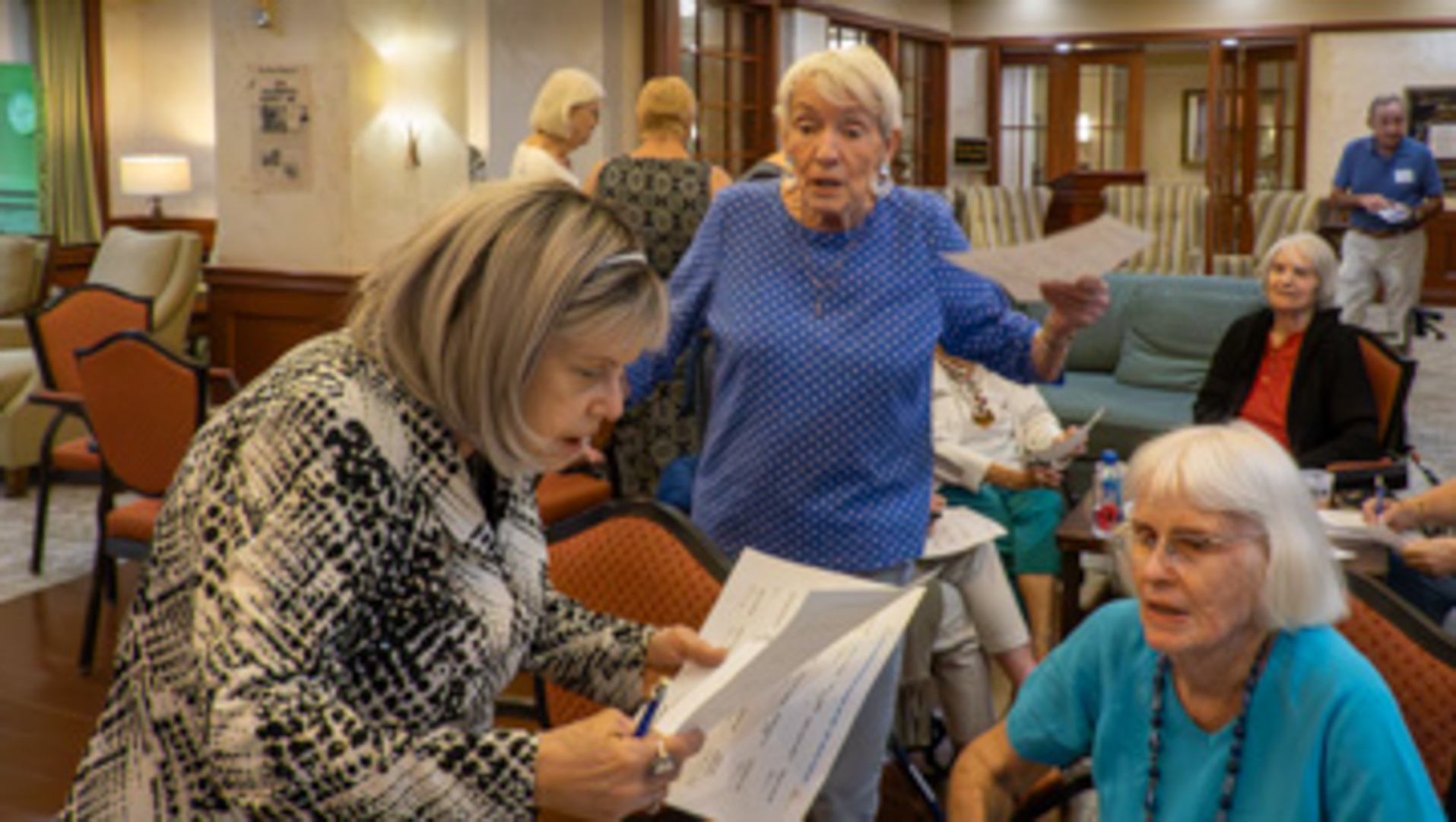 3 women working on their game cards