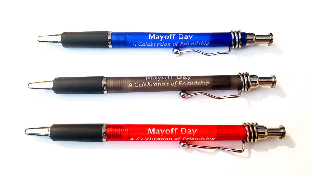 A pen in blue, a pen in gray and a pen in red. All of them say Mayoff Day, A Celebration of Friendship