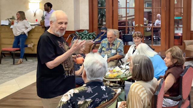 Bernie gets a brief chance to chat with guests