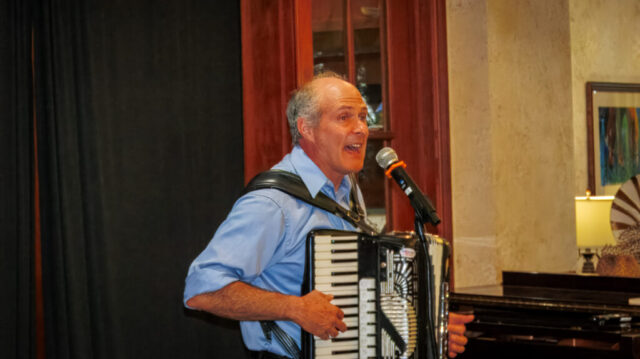 Oliver's endless energy Open-mouthed man playing accordion